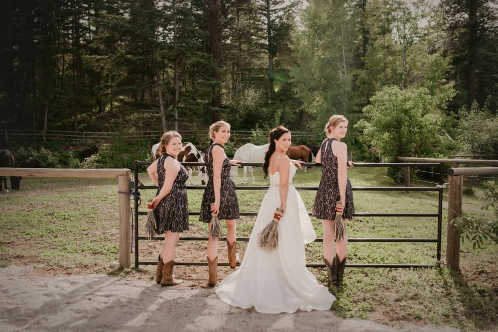 Bride and Bridesmaids Pose with Horses