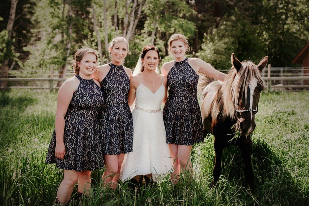 Bride and Bridesmaids Pose with Horse